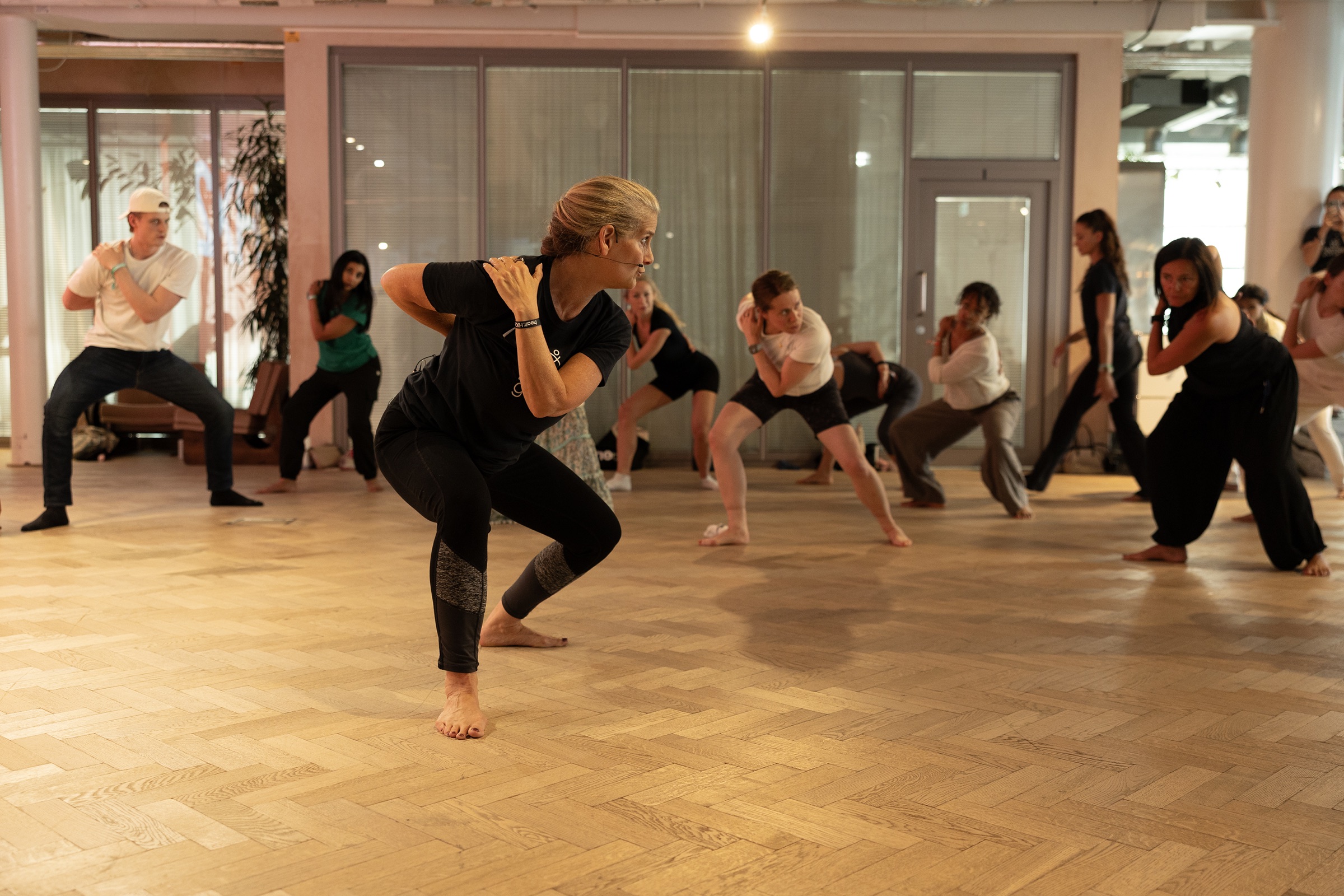 Carolyn Wade leading a Human Garage group through a movement reset